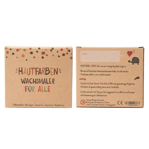 Zwei braune Pappschachteln mit der Aufschrift "Hautfarben Wachsmaler für alle" von Hautfarben, mit je 8 Wachsmalstiften in verschiedenen Hauttönen. Eine Schachtel zeigt die Vorderseite, die andere die Rückseite mit deutschen Produktinformationen.