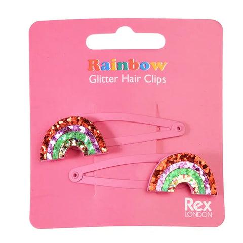 Zwei "Regenbogen" Glitzer-Haarspangen (2er Set) von Rex London auf einer pinken Karte - perfekt als funkelndes Geschenk!.