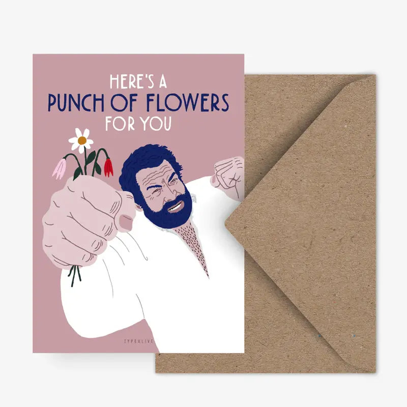 Die Postkarte "Punch of Flowers" von Typealive zeigt einen bärtigen Mann in einem weißen Hemd, der einen Blumenstrauß in der Hand hält, darüber der Text "HERES A PUNCH OF FLOWERS FOR YOU". Wird mit einem braunen Umschlag geliefert.
